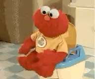 Elmo sitzt auf dem Töpfchen